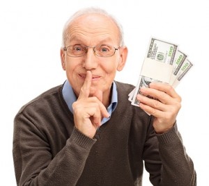 Senior gentleman holding three stacks of money and holding a fin