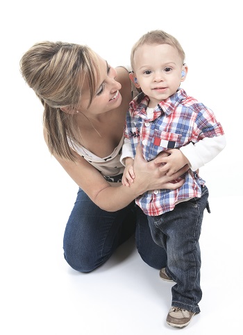 Mother with son. The kid have a Hearing Aids.